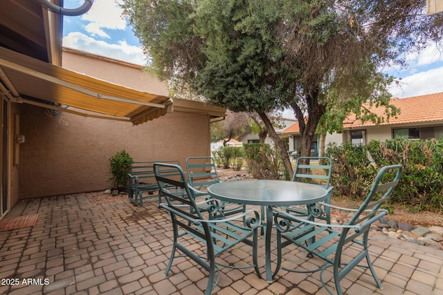 view of patio featuring outdoor dining area