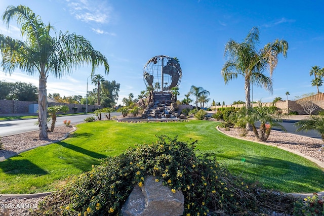 view of community featuring a yard