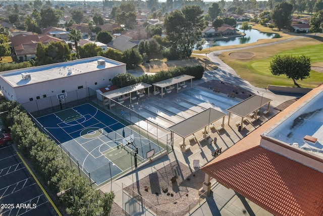 drone / aerial view featuring a water view and a residential view