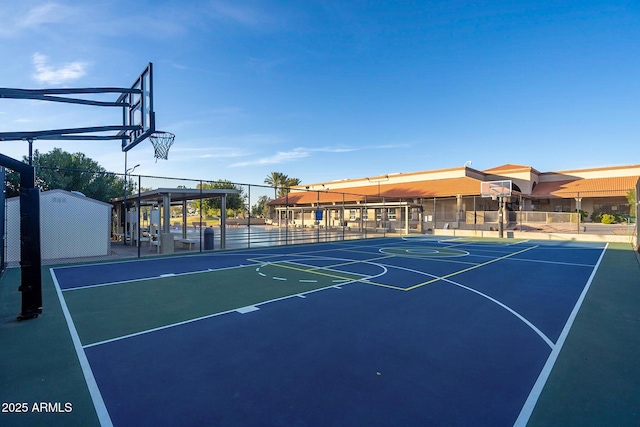 view of basketball court featuring community basketball court and fence