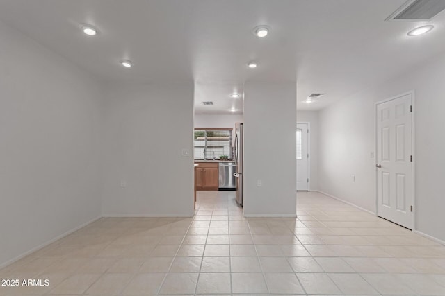 unfurnished living room featuring recessed lighting, light tile patterned floors, baseboards, and visible vents