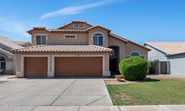 1711 W Houston Ave, Gilbert, AZ 85233 - mediterranean / spanish home featuring stucco siding, driveway, a tiled roof, and a front yard