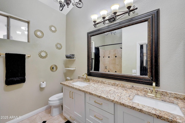 full bathroom featuring toilet, tile patterned flooring, a sink, and a shower with shower curtain