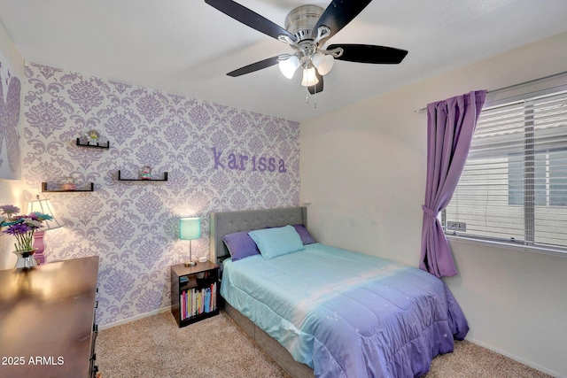 bedroom with light carpet, ceiling fan, baseboards, and wallpapered walls