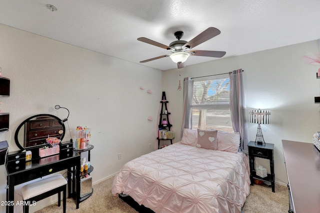 bedroom featuring light carpet, ceiling fan, and baseboards