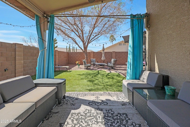 view of patio / terrace with a fenced backyard and an outdoor living space