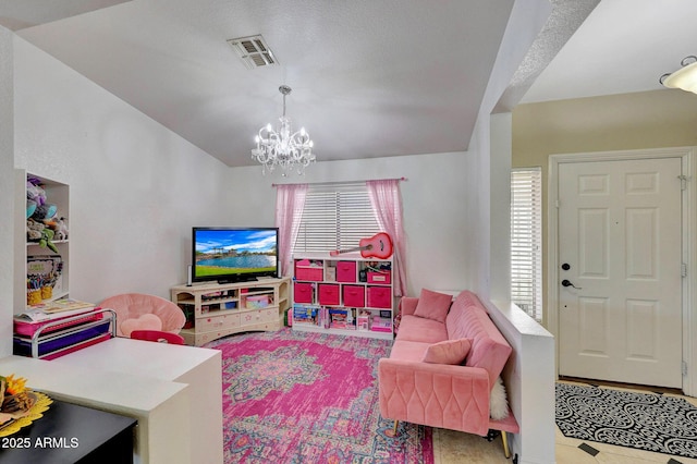 living room featuring an inviting chandelier, visible vents, and a wealth of natural light