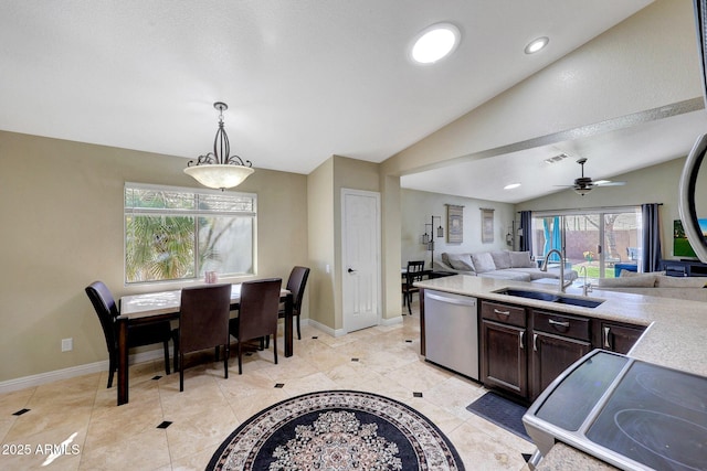 kitchen with pendant lighting, stainless steel dishwasher, open floor plan, a sink, and dark brown cabinets