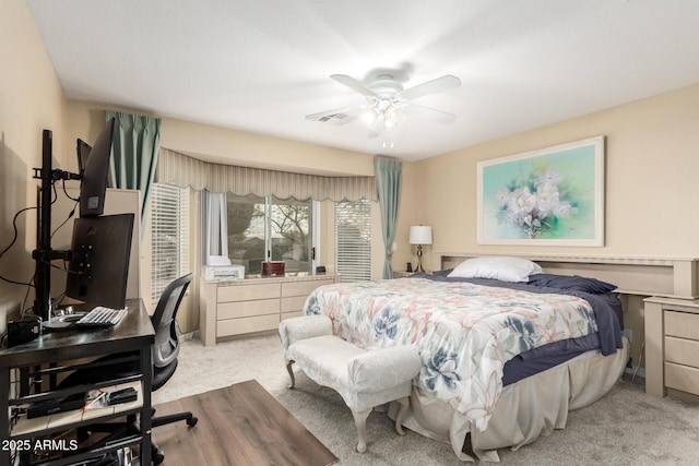 bedroom with light colored carpet and ceiling fan