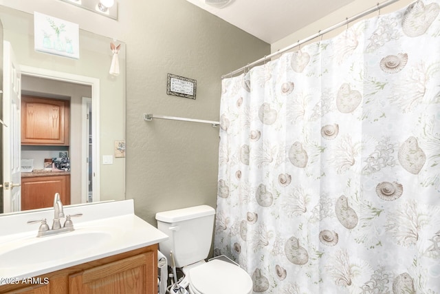 bathroom with vanity, toilet, and a shower with shower curtain