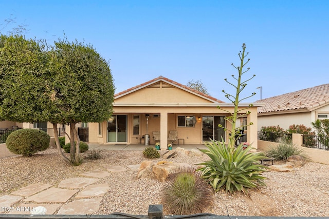 back of property featuring a patio