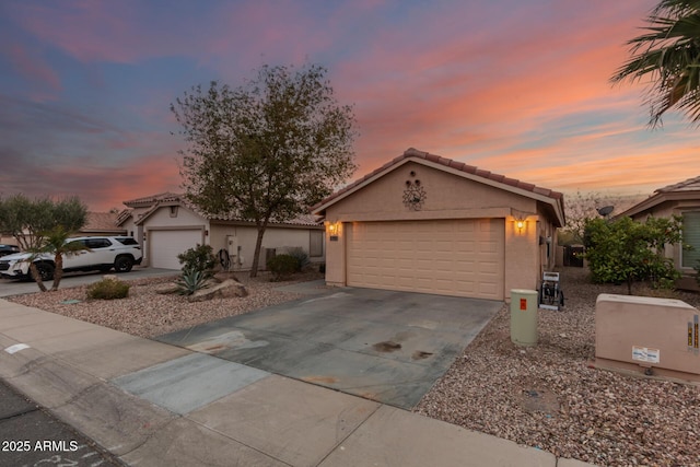 ranch-style home featuring a garage