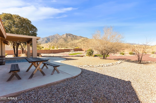 view of yard with a patio and a mountain view