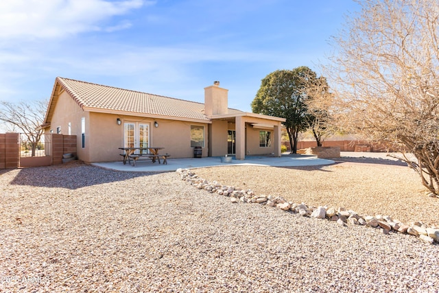 view of front of home with a patio area and french doors