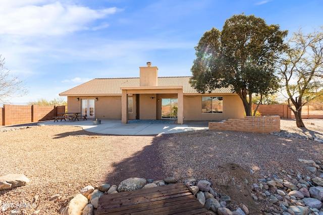 back of property featuring a patio