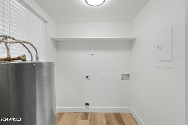 washroom featuring hookup for an electric dryer, washer hookup, gas water heater, hardwood / wood-style flooring, and electric panel