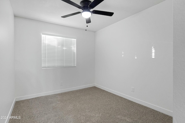 spare room with carpet flooring and ceiling fan