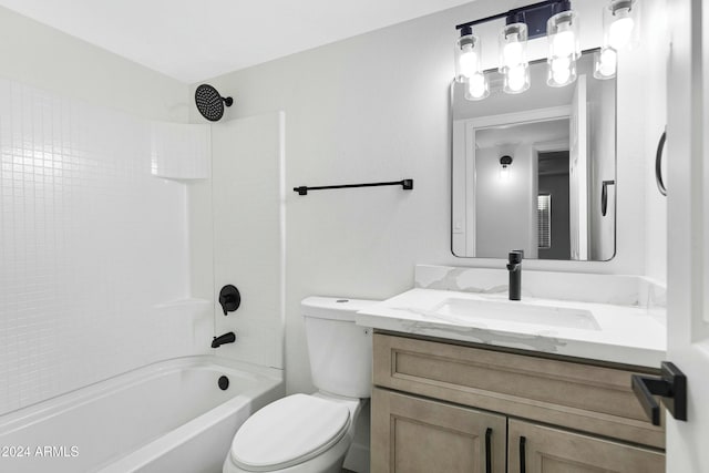 full bathroom featuring toilet, vanity, and washtub / shower combination