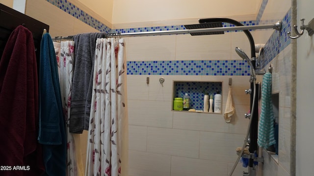 bathroom with tiled shower