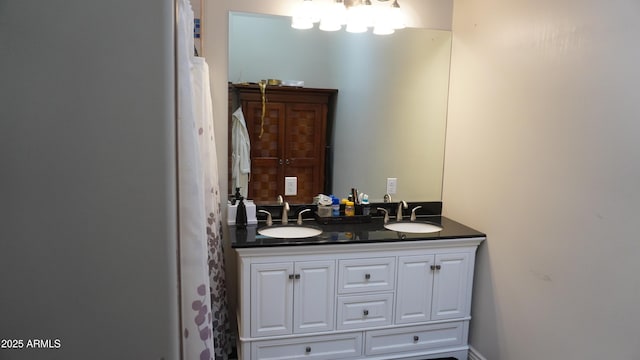full bathroom with double vanity and a sink