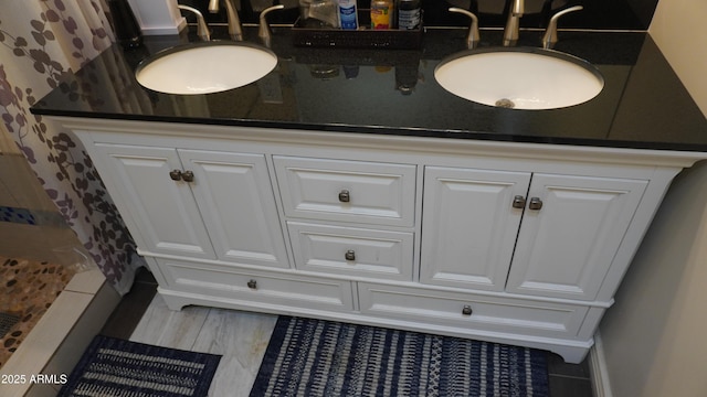 full bath with a shower with shower curtain and vanity
