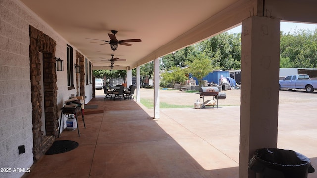view of patio / terrace featuring outdoor dining space and a ceiling fan