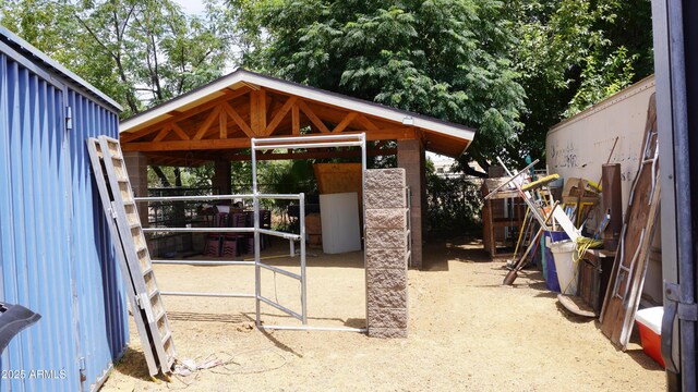 view of patio / terrace with an exterior structure and an outdoor structure