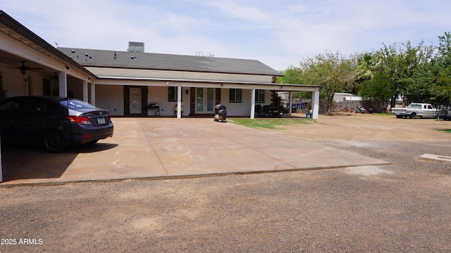 view of front of home featuring french doors and concrete driveway