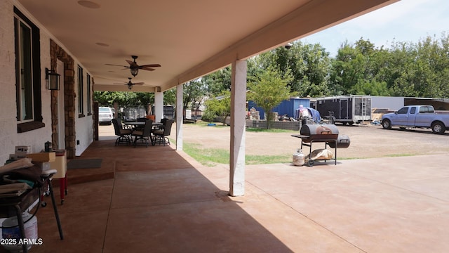 view of patio / terrace with outdoor dining area and a ceiling fan