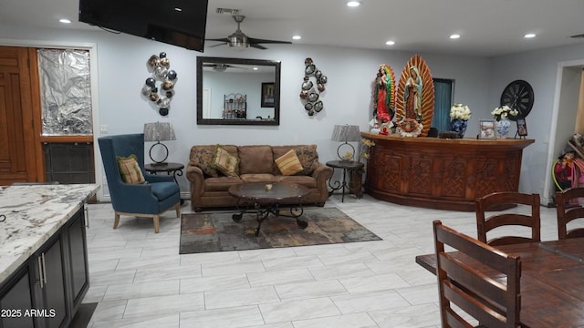 living area with visible vents, ceiling fan, and recessed lighting
