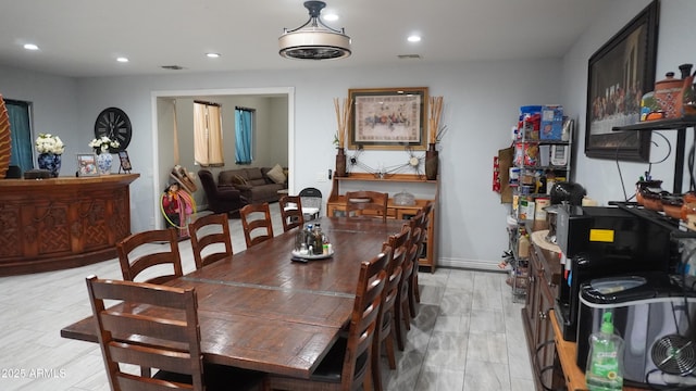 dining space with baseboards, visible vents, and recessed lighting
