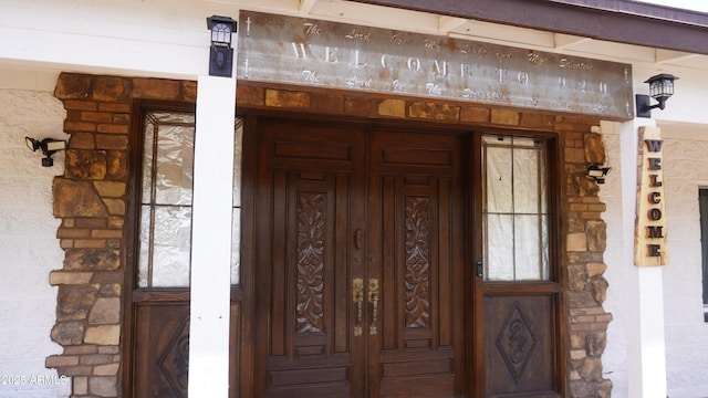 entrance to property with stone siding