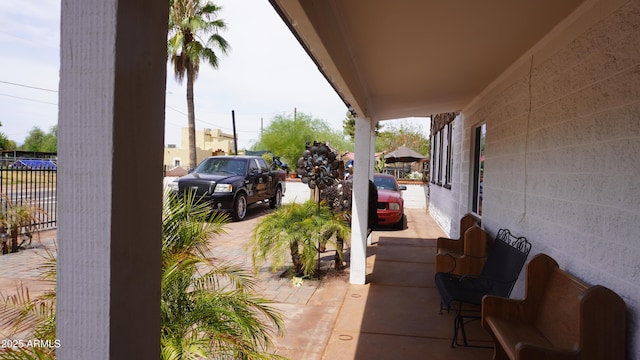 view of patio / terrace featuring fence