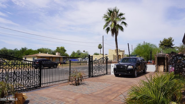 view of gate with fence
