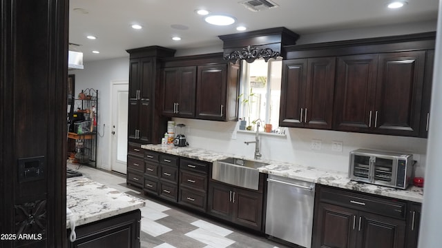 kitchen with dishwasher, a sink, light stone counters, and visible vents