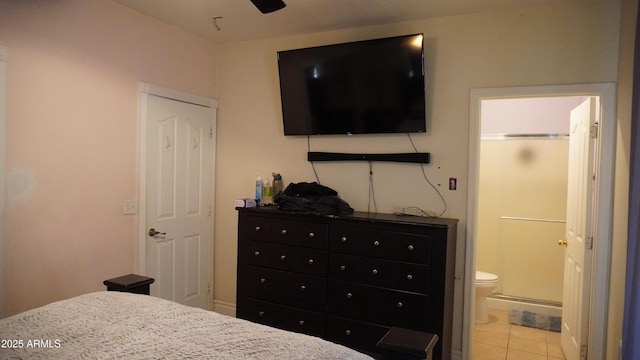 bedroom featuring connected bathroom and light tile patterned floors
