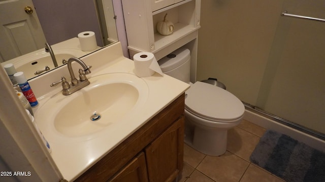 bathroom with a stall shower, tile patterned floors, toilet, and vanity