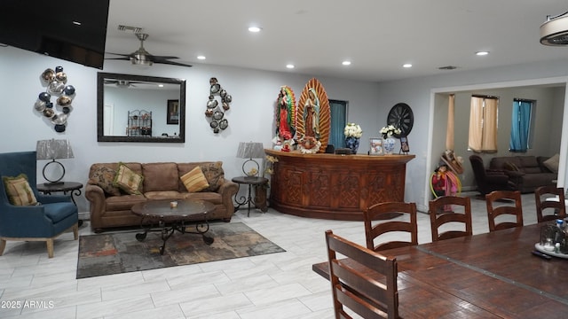 living room with visible vents, recessed lighting, and a ceiling fan