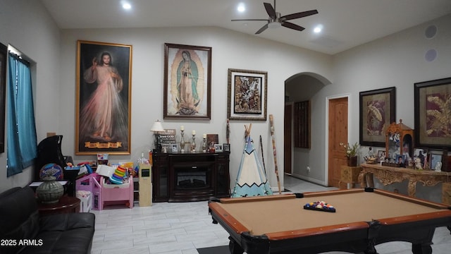 game room featuring lofted ceiling, billiards, arched walkways, and a ceiling fan