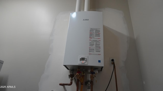 utility room with tankless water heater