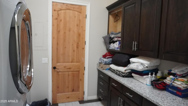 laundry room featuring cabinet space and washer / clothes dryer