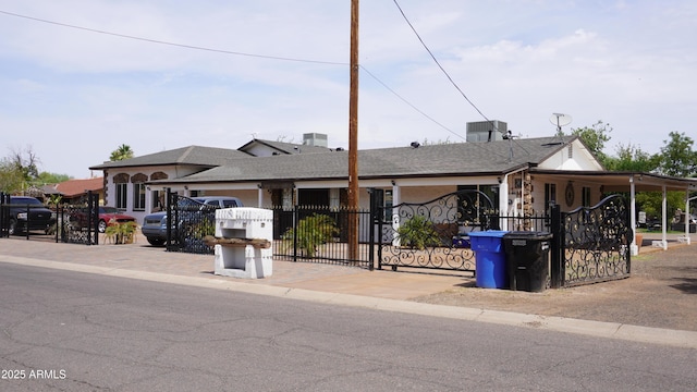 view of front facade featuring a gate and fence