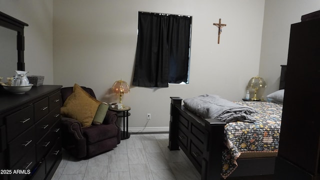 bedroom featuring baseboards