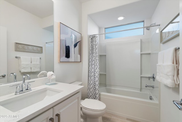 bathroom featuring vanity, toilet, wood finished floors, and shower / tub combo with curtain