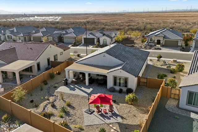 birds eye view of property with a residential view