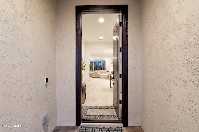 property entrance featuring stucco siding