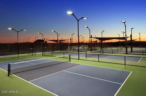 view of sport court featuring fence