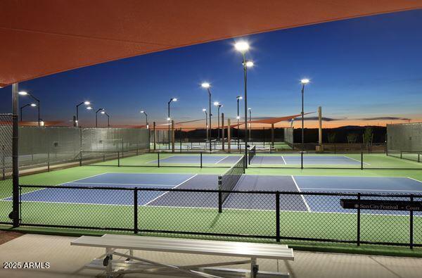 view of sport court featuring fence