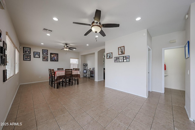 11563 W Jefferson St, Avondale, AZ 85323 - dining space with a ceiling fan, light tile patterned flooring, recessed lighting, baseboards, and arched walkways