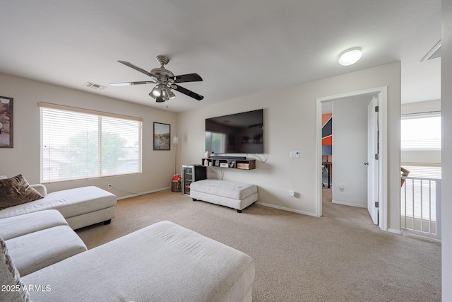 11563 W Jefferson St, Avondale, AZ 85323 - living area featuring carpet floors, a ceiling fan, and baseboards
